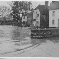 Bridge outside George flooded Looking east past the road outside the George Inn, Barnards and Old Bell Cottage on the right.
