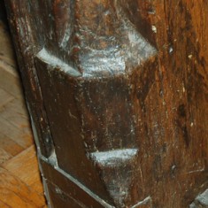 Foot of door frame Carving at the foot of the door frame in the main room.