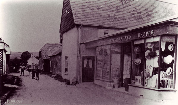Old postcard of The Tudor House with Arthur Warren's shop.