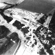 Aerial photograph of the buildings which comprised HMS Mercury. In 1941, Leydene House and 100 acres had been occupied by the Royal Navy, whose Signal School in Portsmouth had suffered from heavy bombing. A Wardroom annex was constructed to the south of the Main House, known as Siberia Block. A large Nissen hut was completed in July 1943 and was used as a cinema, theatre and assembly hall, followed by other training facilities and accommodation.
