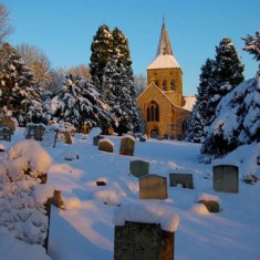 All Saints and gravestones in snow. The graveyard in snow, January 2010. | Michael Blakstad