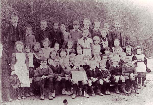 Group of schoolchildren, boy with slate
