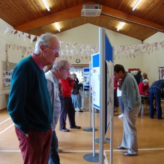 GV with Tony Norman House History panels, History Group member Tony Norman viewing.