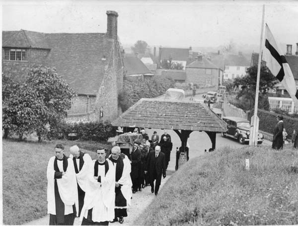Wartime funeral procession, led by Rev Frederick Saunders, left.