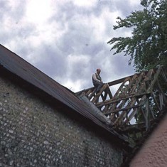 Denys sawing one of the rafters as part of the reconstruction of Frogmore Mill