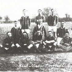 Early soccer team Early team. Goalie Caleb Kille, L. Back W. Nicholson, Ctr Half, P.C.Parminter, L Half, Bill Budd, Outside right Dido Moore, Inside Right, Chris Budd, Ctr Forward Joe Atkinson, Outside Left, Darkie Nicholson. With box, Mr Crockford, With flag, Mr Flux