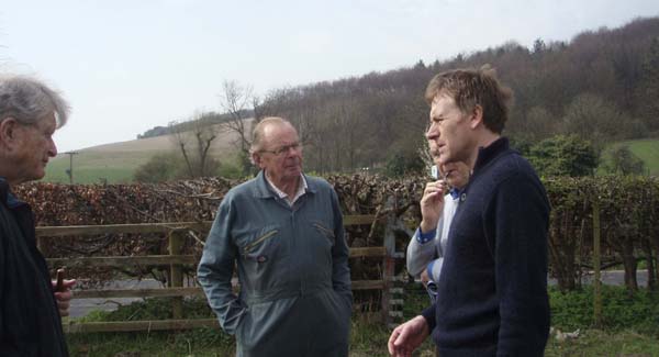 Guy Liardet, chair of Saxons project, discussing with Frank Moffatt, farmer, Michael Blakstad, EMHG, and Dr Nick Stoodley, lead archaeologist, a possible site for a geophysical survey near East Meon