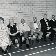 Along the Village Hall wall. Lily Nicholson, Shirley Newbury, Bessy Dowlen, Charlie Dowlen, Eddit Stubbington, Arthur Newbury, Jean Berry, John Berry Village Hall dance 1. ç