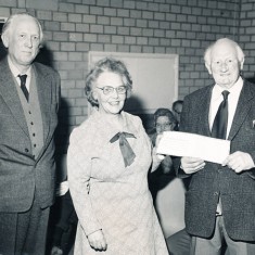 Herbie Goddard receives certificate from his successor, Betty Tucker, March 1981.
