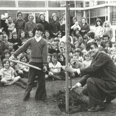 Jonathan Sparrow, Wynn Lewis, headmaster Jonathan Sparrow and Wynn Lewis, headmaster, planting tree in school grounds.