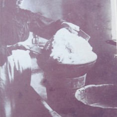 Jane Wren, working butter by hand at Riplington Farm, c 1908