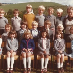 Schoolchildren in group Schoolchildren. Back row, second from left, Ian Whitear. On right, Miss Mackiness. Middle row, second from left, Justin Whitear. Middle front, Deborah Neale, next to her, Amanda Cobb.