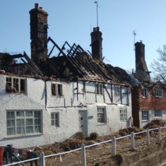 Hockley & Brook after fire, from west The remains of the second thatch fire at Hockley & Brook Cottages, 2013. | Michael Blakstad