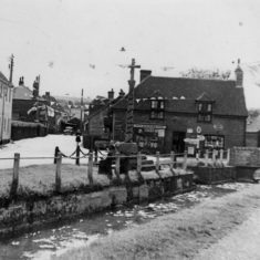 River, Pinks store and war memorial covered in bunting for the Coronation of Elizabeth II in June 1953