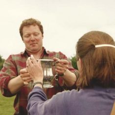Rory collecting cup Rory Bremner collects the cup on behalf of his team.
